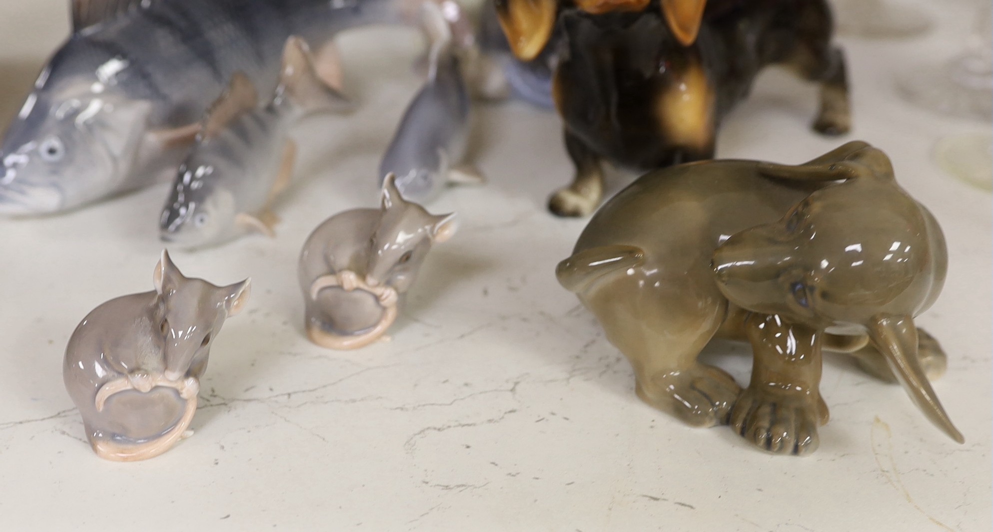 A Royal Copenhagen figure group of two children hugging a puppy, two other dog ornaments, three fish and a pair of mice (8). Tallest 16cm